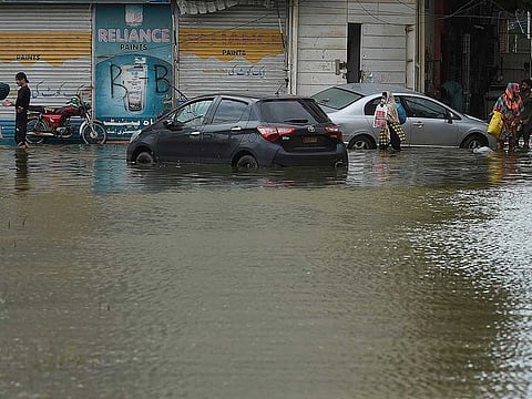 A waterlogged street in Karachi. The chief minister of Sindh has ordered immediate steps to weed out absentee workers in the municipal services who continue to draw salaries.
