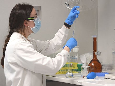 A chemist works at AstraZeneca's Sydney headquarters.