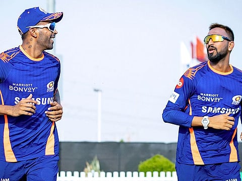 The Pandya brothers, Hardik (left) and Krunal limber up during training at the ICC Academy ground.