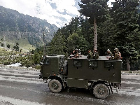 Indian army soldiers are seen atop a vehicle on a highway leading to Ladakh, at Gagangeer in Kashmir's Ganderbal district September 2, 2020.