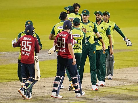 Pakistan players greet England batsmen after their win in the third Twenty20 cricket match, at Old Trafford in Manchester.