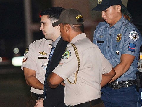 Convicted U.S. Marine Lance Cpl. Joseph Scott Pemberton is escorted to his detention cell upon arrival at Camp Aguinaldo at suburban Quezon city.