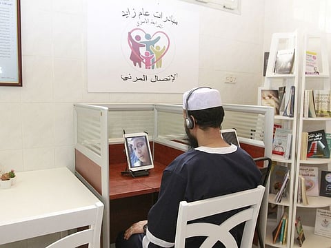 An inmate at a Fujairah prison video chats with his family. Picture for illustrative purposes only.