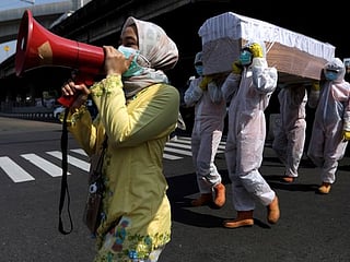 In Indonesia, shock coffin tactics nail coronavirus risks