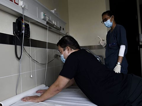 Francis Naratefeliciano during his physiotherapy session at Canadian Hospital in Dubai last month.