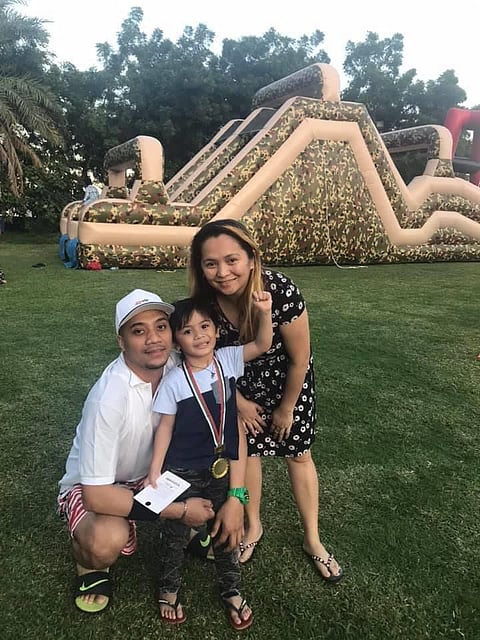 Edrian Afuang with his wife and son.