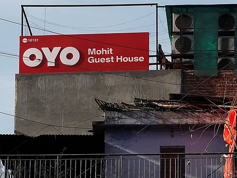The logo of OYO, India's largest hotel chain on a hotel building in New Delhi. Softbank Group is taking a direct role in managing its virus-hit hospitality startup Oyo’s operations in Latin America through a joint venture.