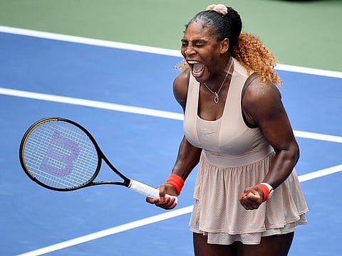 Serena Williams celebrates after match point against Maria Sakkari.