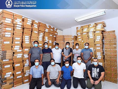 A gang of 11 Asian men were arrested for stealing 662 computers worth Dh1.4 million.