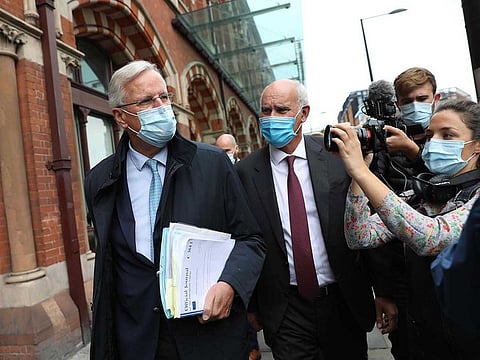 EU chief Brexit negotiator Michel Barnier (L) and EU ambassador to the UK Joao Vale de Almeida (R) walk out of London St Pancras station after arriving in London on September 9, 2020 for the latest round of trade talks with the UK. Britain readied on September 9 to intentionally breach its EU divorce treaty with new legislation that critics warned would undermine its global standing and any hopes for an orderly exit out of the world's biggest single market.