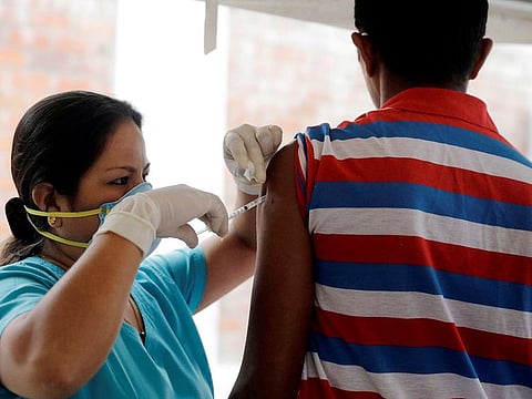 A Venezuelan migrant receives a vaccination at the Binational Border Service Center of Peru, in Tumbes, Peru June 14, 2019