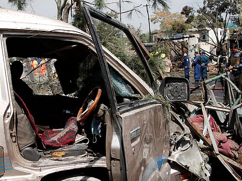 Afghan security personnel work at the site of an explosion in Kabul, Afghanistan, Wednesday, Sept. 9, 2020.