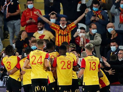 Ignatius Ganago celebrates scoring for Lens against PSG.