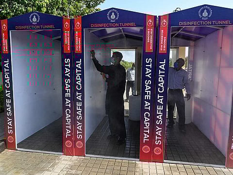 Workers check disinfection tunnels at the Capital University of Science and Technology in Islamabad