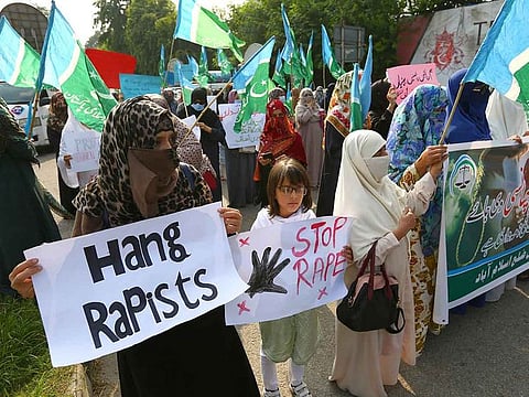 People participate in a demonstration to condemn the rape on a deserted highway in Pakistan