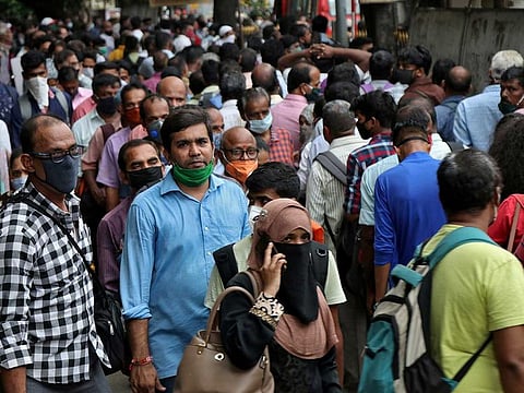 People wait to board passenger buses during rush hour at a bus terminal, amidst the coronavirus disease (COVID-19) outbreak, in Mumbai, India, September 9, 2020.