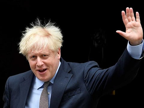 Britain's Prime Minister Boris Johnson waves as he leaves Downing Street in London on September 9, 2020.