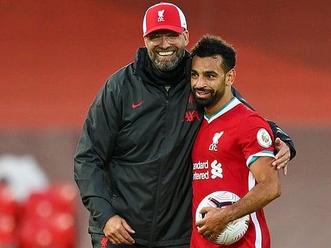 Liverpool boss Jurgen Klopp congratulates Mo Salah on his hat-trick against Leeds United.