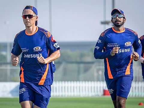 Mumbai Indians' attacking lynchpins Trent Boult (left) and Jasprit Bumrah warm up before their practice session on Sunday.