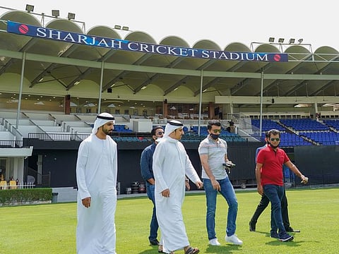 Sourav Ganguly walks into Shrajah Cricket Stadium with Waleed Bukhatir to take a first hand look at the venue's preparations for the IPL.