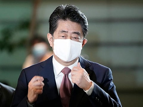 Japan's outgoing Prime Minister Shinzo Abe arrives at the prime minister's office for a cabinet meeting Wednesday, Sept. 16, 2020, in Tokyo.