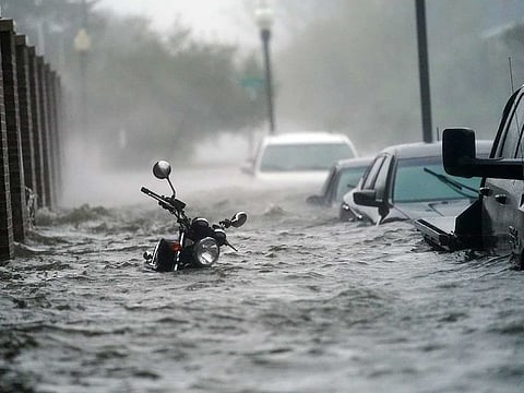 Flood waters move on the street, Wednesday, Sept. 16, 2020, in Pensacola, Fla. Hurricane Sally made landfall Wednesday near Gulf Shores, Alabama, as a Category 2 storm, pushing a surge of ocean water onto the coast and dumping torrential rain that forecasters said would cause dangerous flooding from the Florida Panhandle to Mississippi and well inland in the days ahead.