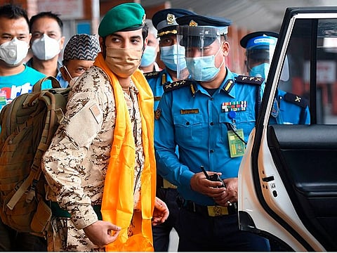 Prince Khalifa a member of the Bahrain Royal Guard arrives at the Tribhuvan International Airport in Kathmandu on September 16, 2020. - The 18-member party from Bahrain was given a special permission to enter Nepal to mountaineer the Mount Manaslu 8,163-metre (26,781-feet) and Mount Lobuche 6,119-metre (20,075-feet)