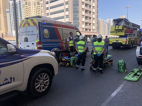 National Ambulance, Sharjah Police and firefighters at the site of the fire