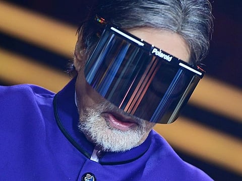 Amitabh Bachchan wearing a face shield.