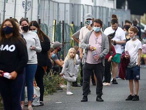 People queue at a test centre following an outbreak of the coronavirus disease (COVID-19) in Southend-on-sea, Britain September 16, 2020.