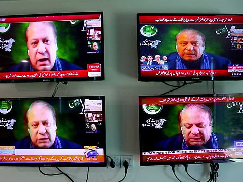 Pakistani news channels telecast live Pakistan's ailing former Prime Minister Nawaz Sharif addressing opposition parties meeting in Islamabad, Pakistan on Sunday, Sept. 21, 2020. Sharif broke a yearlong silence from exile in London to vow to oust Imran Khan from office