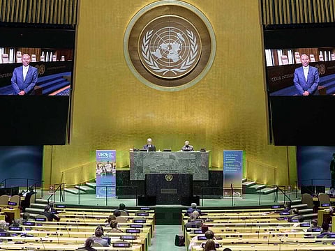 In this photo provided by the United Nations, President of the International Court of Justice, Judge Abdulqawi Ahmed Yusuf, is seen on screens as he addresses the United Nations General Assembly to commemorate the 75th anniversary of the United Nations.