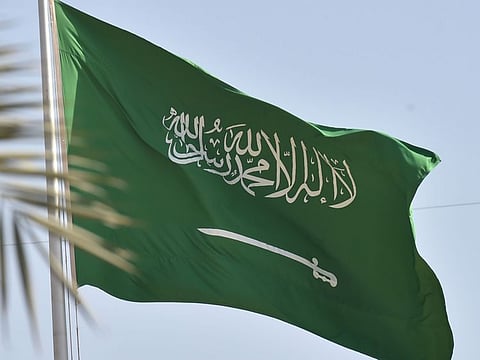 A picture taken on September 22, 2020 shows a Saudi national flag in the capital Riyadh