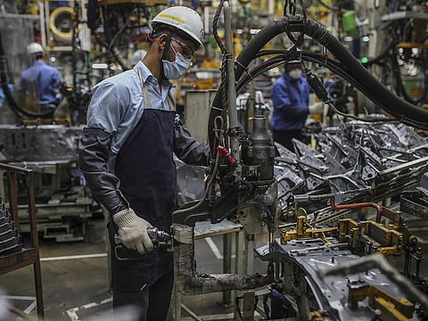 Workers at car production facility in India. The Indian economy is expected to suffer lasting damage from the current coronavirus crisis and after an initial strong rebound in fiscal year ending March 2022.