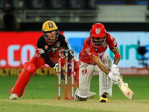 Kings XI Punjab captain KL Rahul sweeps one during his innings of unbeaten 132, highest individual score by an Indian batsman in IPL.