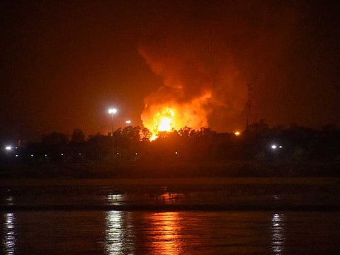 Flames rise from Oil and Natural Gas Corporation (ONGC) plant after a fire broke out in it in the wee hours, in Surat, Thursday, Sept. 24, 2020