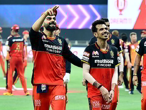 Virat Kohli and Yuzvendra Chahal celebrate Royal Challengers Bangalore's win over Sunrisers Hyderabad in Dubai.