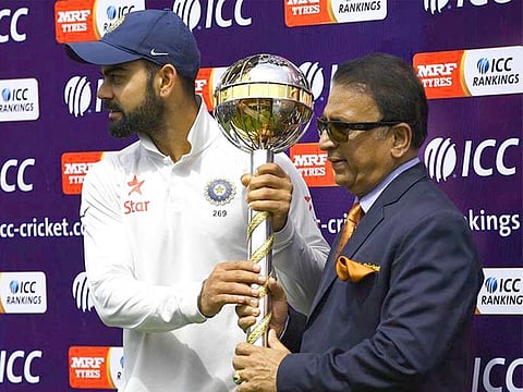 India and Royal Challengers Bangalore captain Virat Kohli with Sunil Gavaskar in 2017.