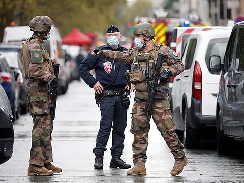 Security forces guard the scene of a stabbing incident near the former offices of French magazine Charlie Hebdo, in Paris, France September 25, 2020.