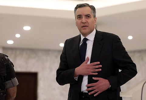 Lebanon's Prime Minister-designate Mustapha Adib gestures after saying that he is stepping down at the presidential palace in Baabda, Lebanon, September 26, 2020.