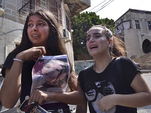 Lebanese girls mourn during the funeral procession of two children Sufian Mohammed 2½-year-old and Mohammed Nazir two-year-old, who passed away earlier this month as a result of severe heat with no food or water while on a boat with their parents attempting to migrate to Cyprus, in Tripoli, north Lebanon, September 25, 2020. The parents threw the bodies of their children in the sea after they died, fearing they will not return to shore, and their bodies were found several days later. Their trip on a fishing boat ended with at least four among the dozens of passengers losing their lives, while several others are still missing.