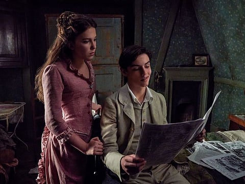 Millie Bobby Brown as Enola Holmes and Louis Partridge as Tewksbury.
