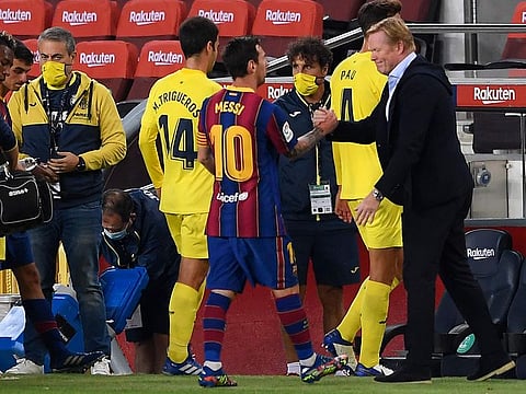 Lionel Messi with Barcelona coach Ronald Koeman