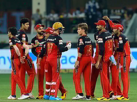 Royal Challengers Bangalore players celebrate the wicket of Hardik Pandya of Mumbai Indians during match held at the Dubai International Cricket Stadium.