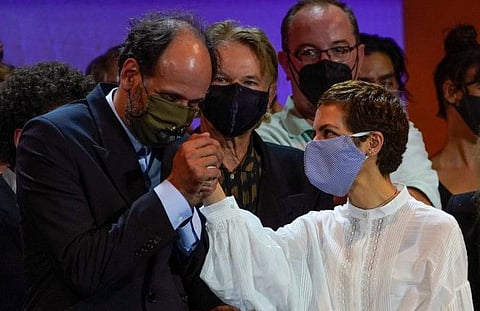 President of the Official Jury Luca Guadagnino holds the hand of director Dea Kulumbegashvili, who won the Concha de Plata (Silver Shell) for Best Director for the film "Beginning", during the San Sebastian Film Festival, in San Sebastian, Spain, September 26, 2020.