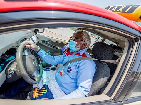 A Dubai Taxi driver in Al Garhoud.