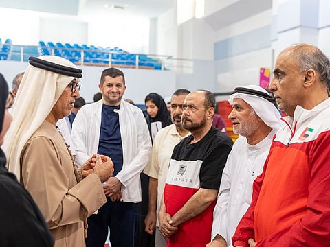 Dr. Mugheer Al Khaili, DCD’s Chairman, with elders.