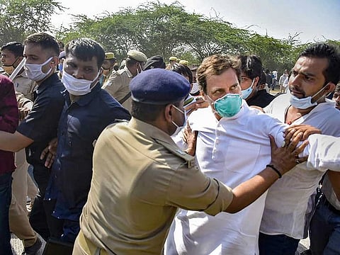 Congress leader Rahul Gandhi being stopped by police personnel while on his way to Hathras along with party workers to meet the family members of a 19-year-old Dalit woman who was murdered and gang-raped two weeks ago. Gandhi's vehicle was stopped by the authorities, at Yamuna Expressway in Noida, Thursday, Oct. 1, 2020.