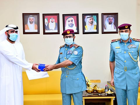 Brigadier Ahmad Al Serkal, Director General of Police Operations, Sharjah, in the presence of Colonel Yusef Obaid bin Harmoul, Director of the Comprehensive Police Stations Department, on Saturday honoured Muhammad Abdullah Mohammad Al Bloushi.