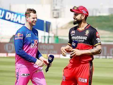 Steve Smith, captain of Rajasthan Royals, with Royal Challengers Bangalore skipper Virat Kohli, during the IPL in UAE